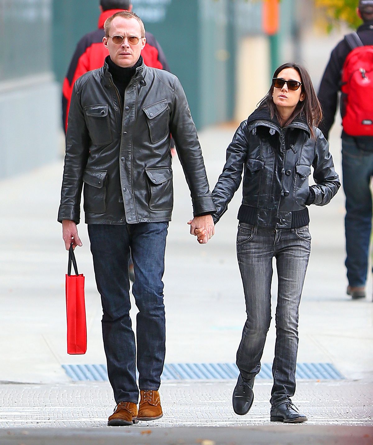 Jennifer Connelly and Paul Bettany hold hands while walking in NYC
