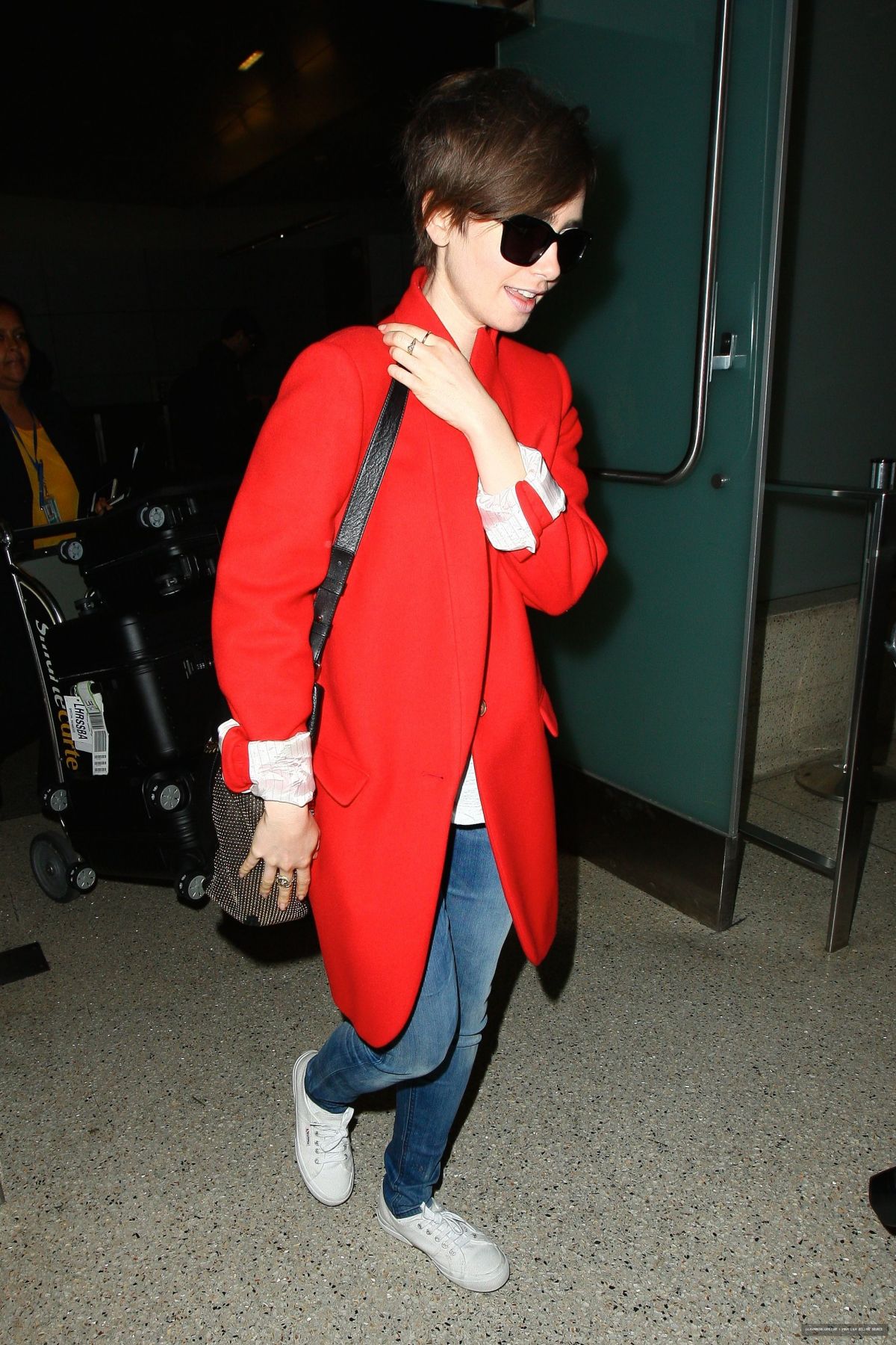 LILY COLLINS Arrives at Los Angeles International Airport – HawtCelebs