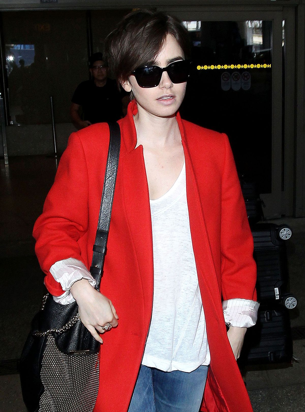 LILY COLLINS Arrives at Los Angeles International Airport – HawtCelebs