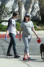 Pregnant ANNE HATHAWAY Walks Her Dog Out in Los Angeles 02/14/2016