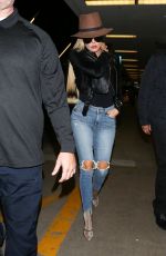 KHLOE KARDASHIAN in Ripped Jeans at LAX Airport in Los Angeles 10/20/2016