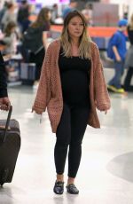 Pregnant HILARY DUFF at JFK Airport in New York 08/26/2018