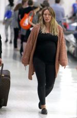 Pregnant HILARY DUFF at JFK Airport in New York 08/26/2018