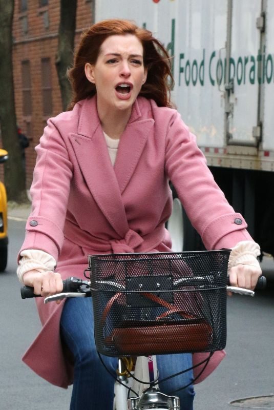 ANNE HATHAWAY Riding a Bike on the Set of Modern Love in New York 11/28/2018
