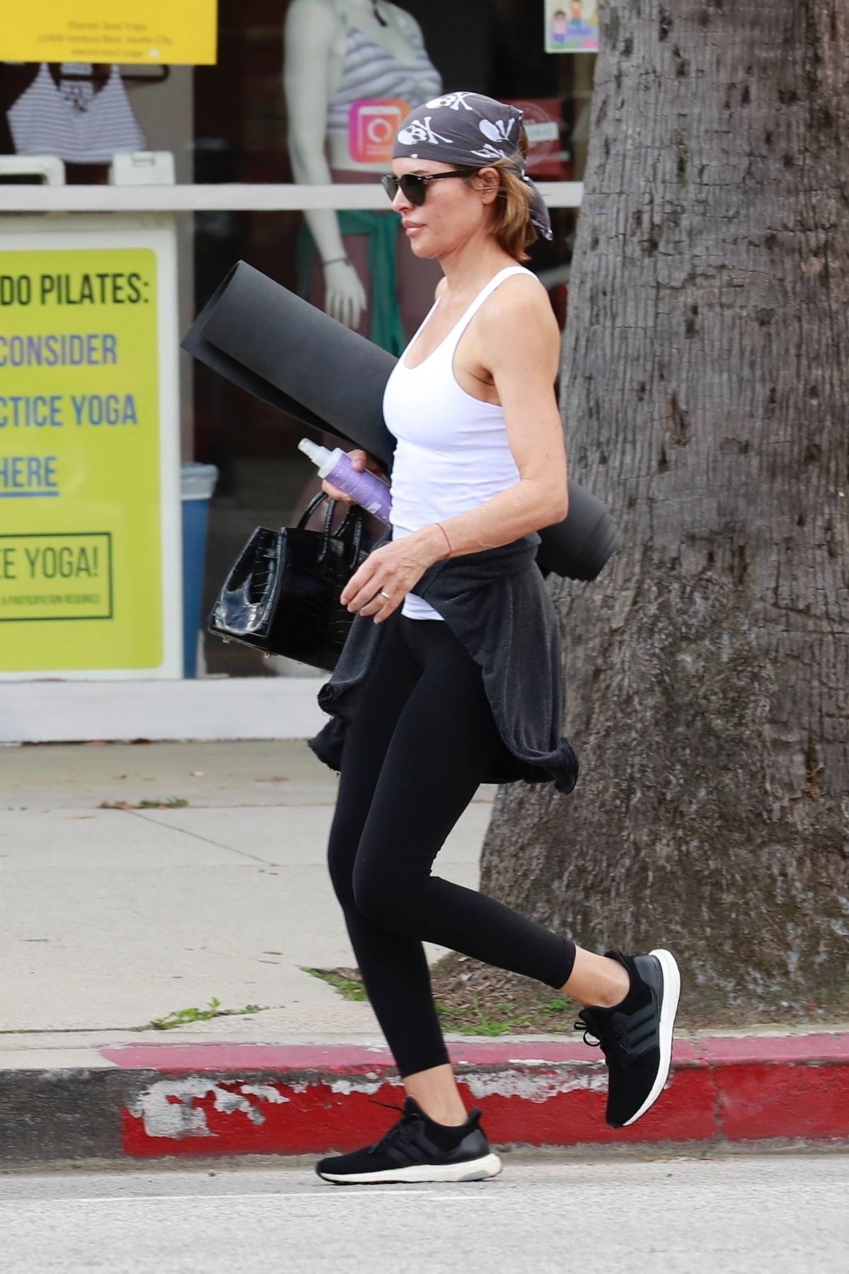 Lisa Rinna trades in the leggings for trousers as she transforms from yoga  student to city girl