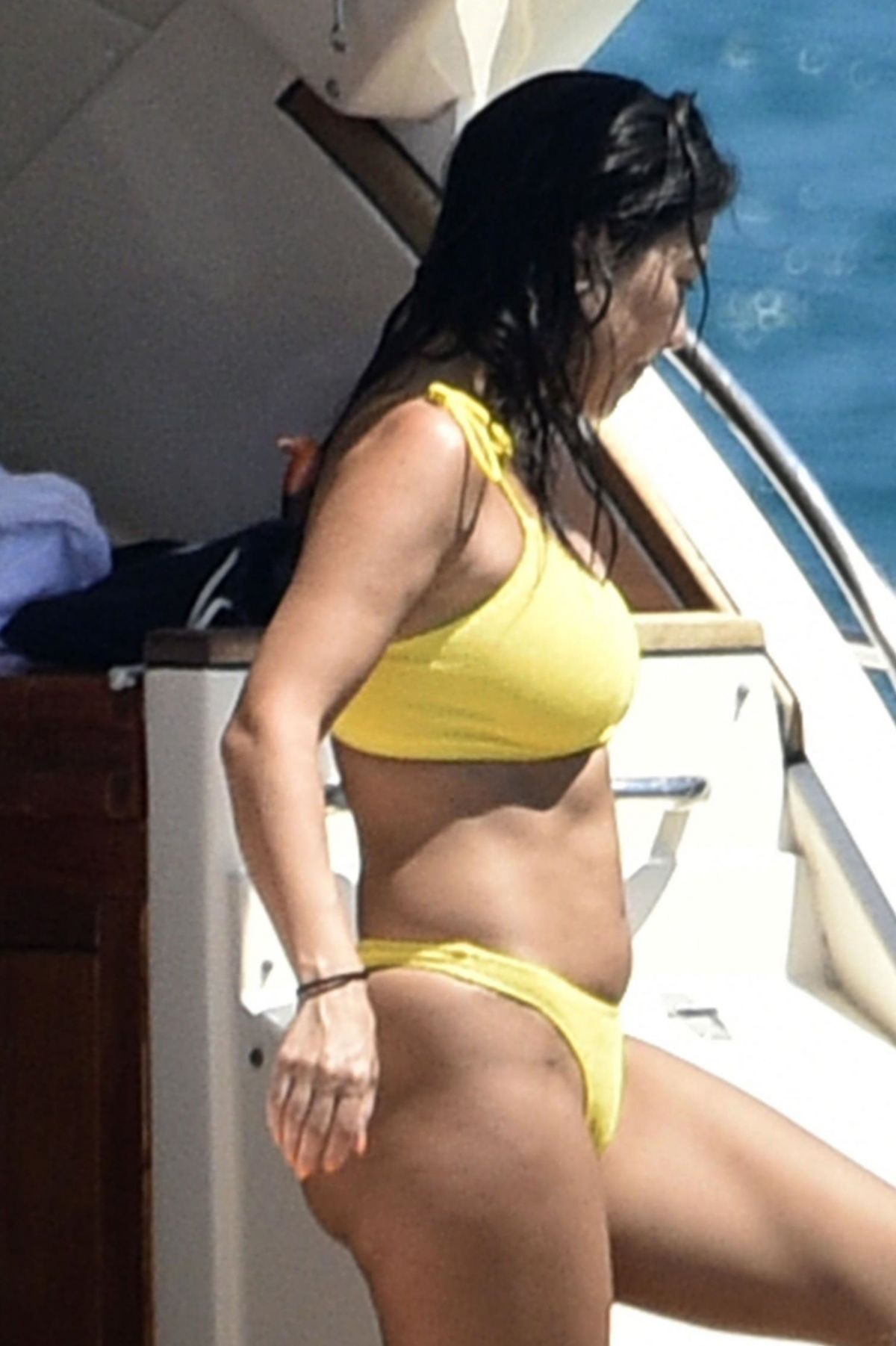 kourtney-kardashian-in-yellow-bikini-at-a-yacht-in-corsica-07-26-2019-16.jpg