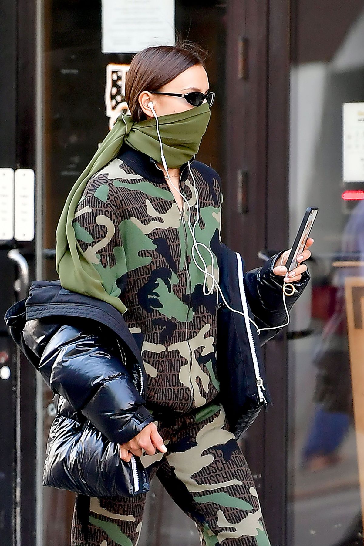 IRINA SHAYK in Camouflage Moschino Jumpsuit and Army Green Scarf Out in ...