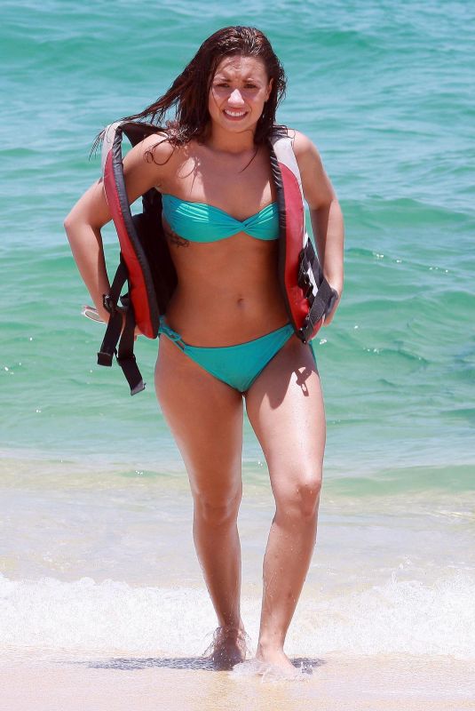 DEMI LOVATO in Bikini on the Beach in Cabo San Lucas 06/16/2010