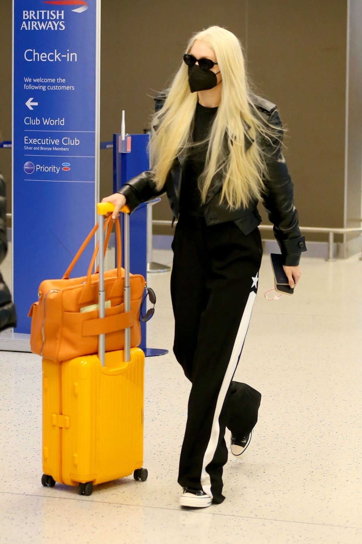 Gigi Hadid carries a Prada crochet bag @ JFK Airport July 25, 2023