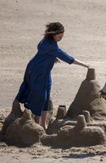 OLIVIA COLMAN Makes Sandcastles on Camber Sands Beach 05/12/2022