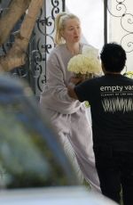 ERIKA JAYNE Receiving Bouquet of Flowers on Her 52nd Birthday in Los Angeles 07/10/2023