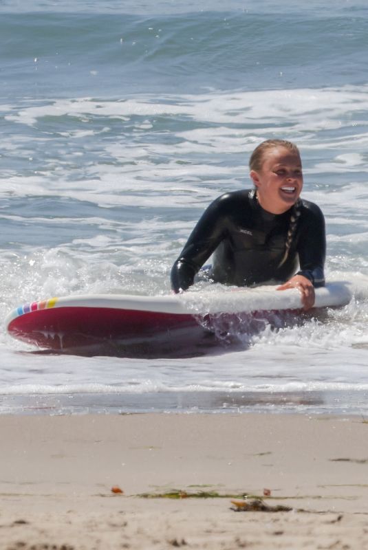 JOJO SIWA in Wetsuit Out Surfing with Her Dad in Malibu 09/07/2023