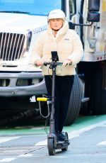 DEBORRA-LEE FUENTES Riding an Electric Scooter Out in New York 03/25/2024