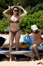 HEIDI KLUM in Bikini at a Beach in Sardinia 06/19/2024