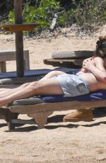 LENI KLUM in a White Bikini at a Beach in Sardinia 06/26/2024