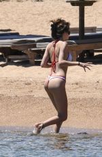 LENI KLUM in Bikini on the Beach in Sardinia 06/26/2024