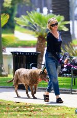 MELANIE GRIFFITH Out with Her Fogs at a Park in Beverly Hills 06/18/2024