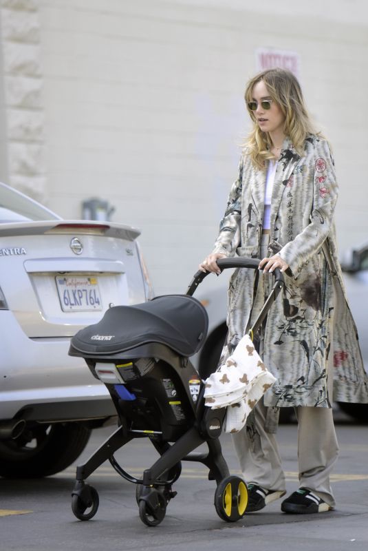 SUKI WATERHOUSE Out with Her Baby in Los Angeles 06/17/2024