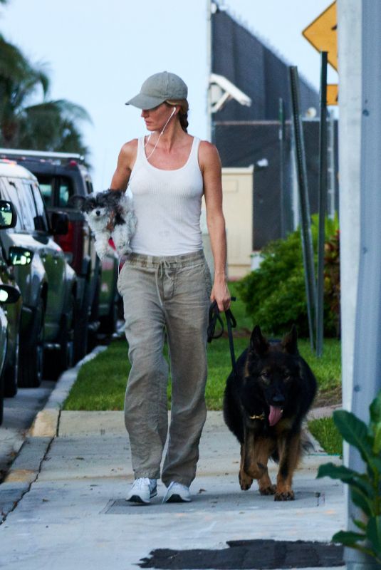 GISELE BUNDCHEN Walks Her Out Dog in Miami 07/01/2024